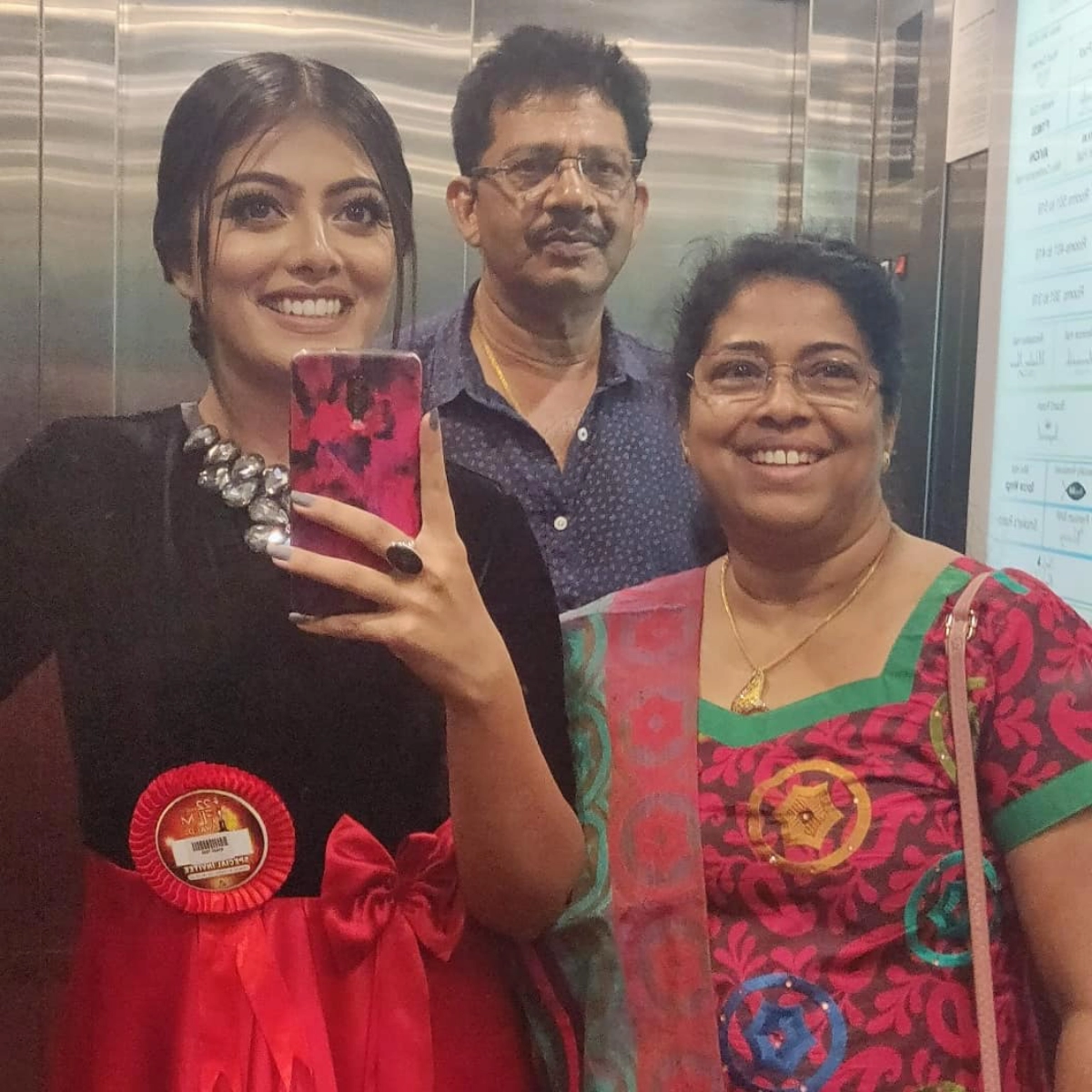Merin Philip family photo with her father Philip C Mathew and mother Daisy Philip