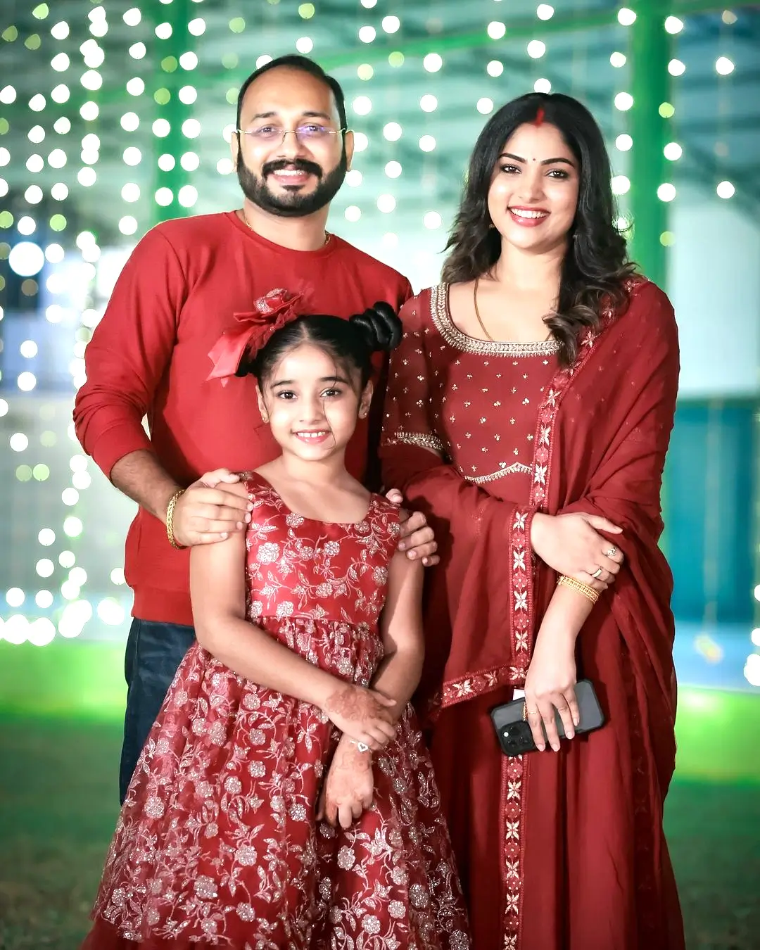 Muktha with her husband and daughter