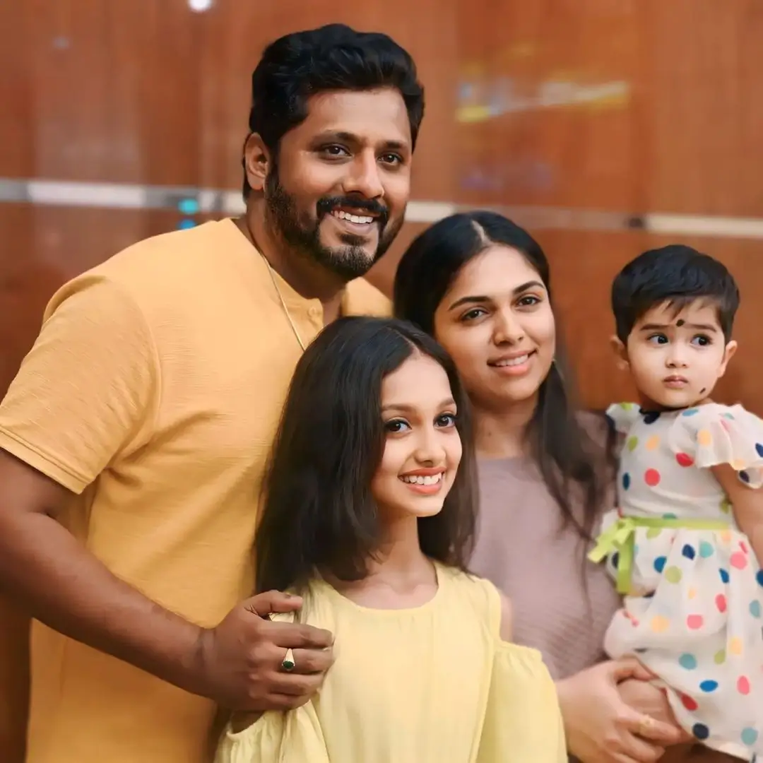 Anjali Nair with her husband and children